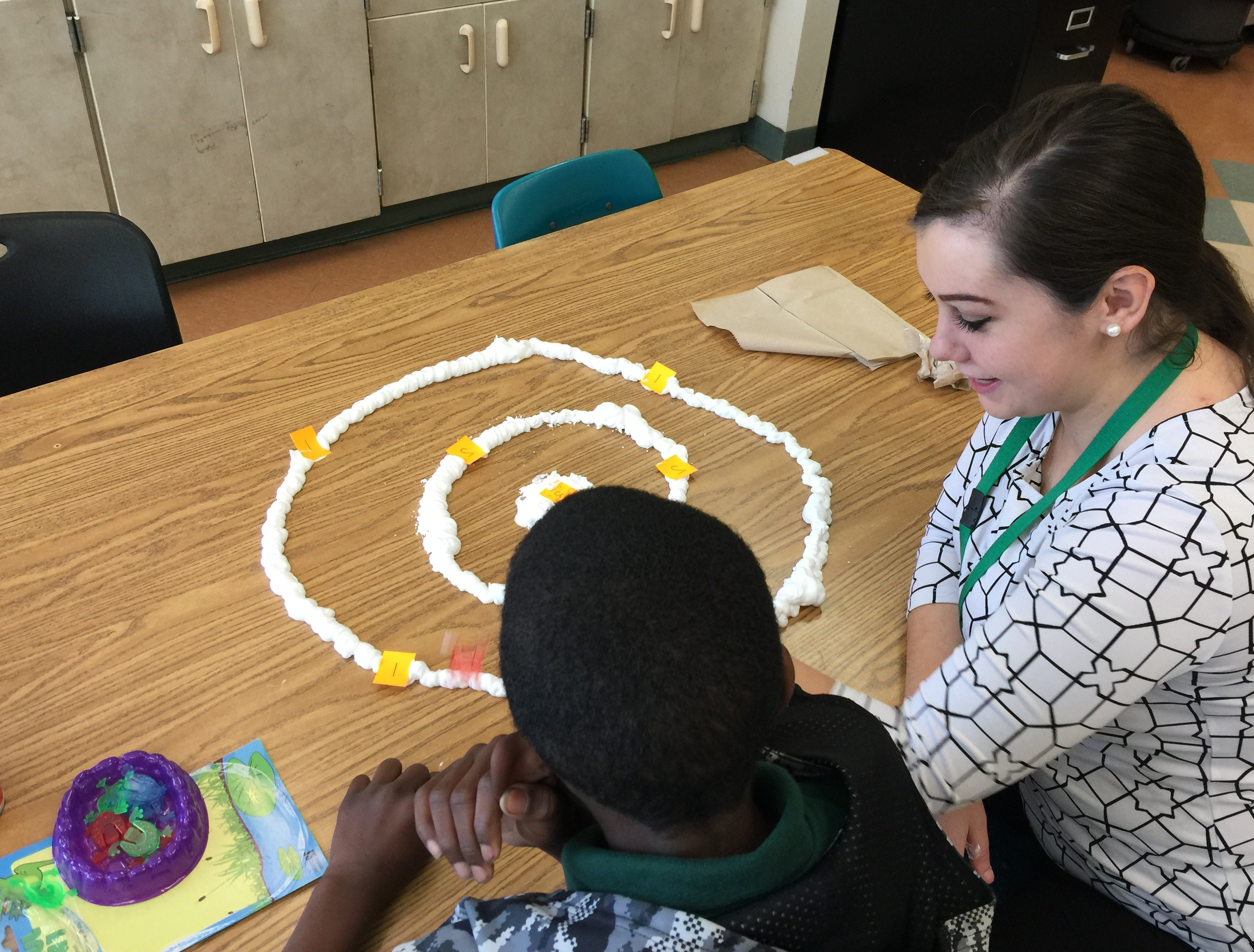 An MS SLP student works with a student at the GRASP Academy​.​​